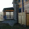 Hand-laid bluestone patio and custom-built propane tank screen